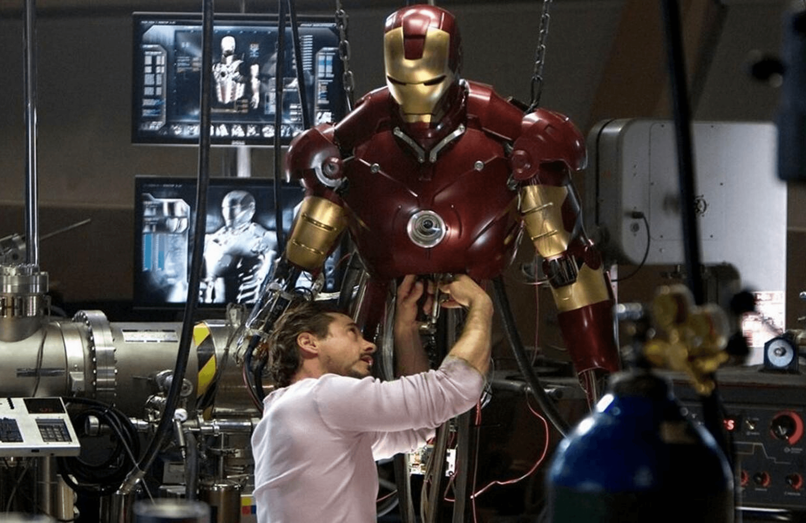 Tony Stark building the Iron Man suit in his workshop